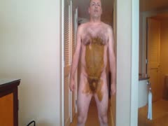 A pervert man flaunting his physique while covered in his own excrement